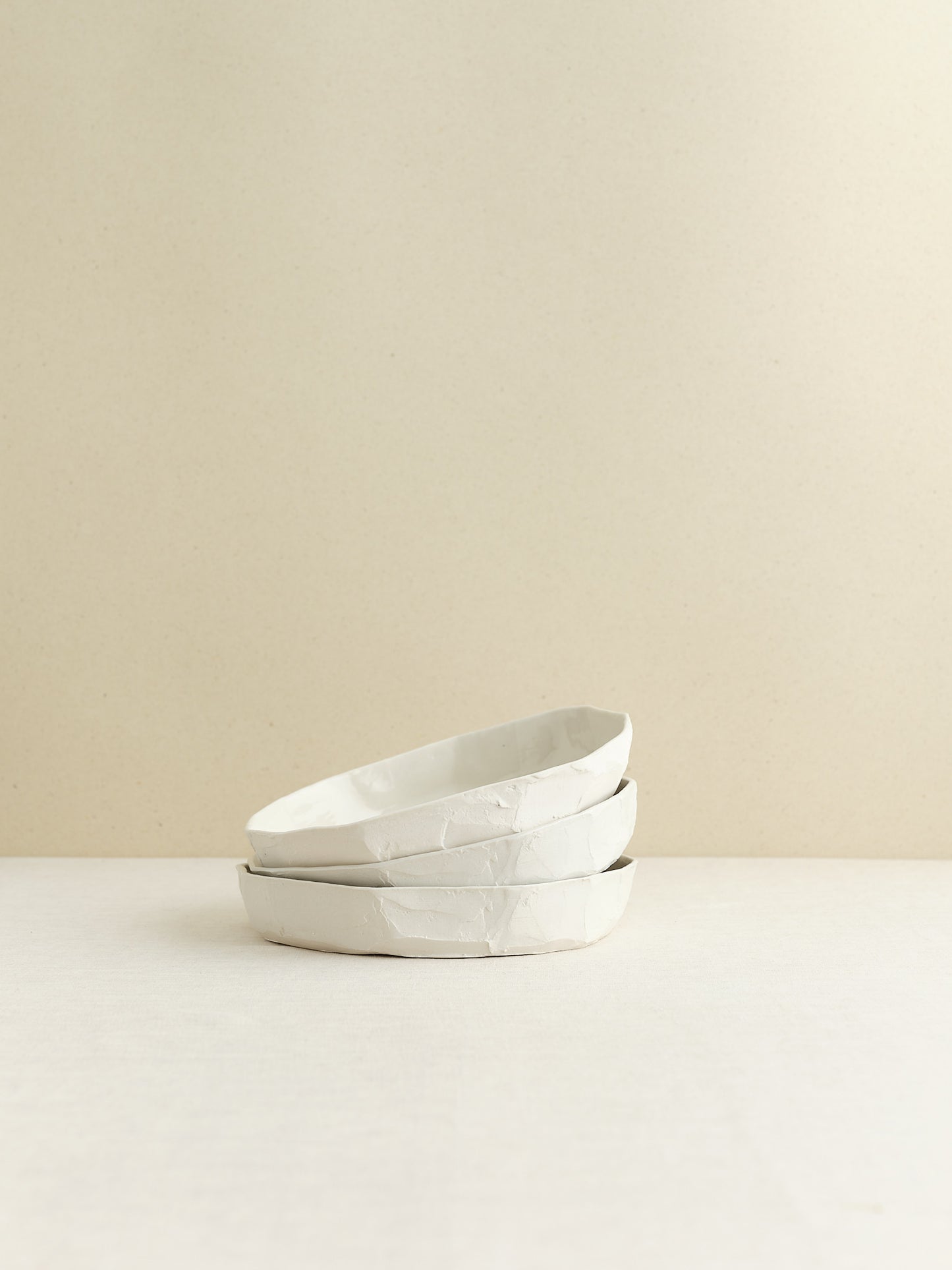 high-walled medium sized porcelain plate is handmade in Zurich