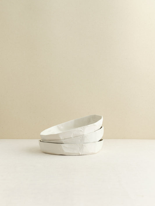 high-walled medium sized porcelain plate is handmade in Zurich
